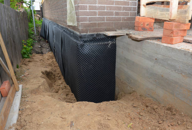 Happy homeowners after waterproofing job in Pleasant Plain